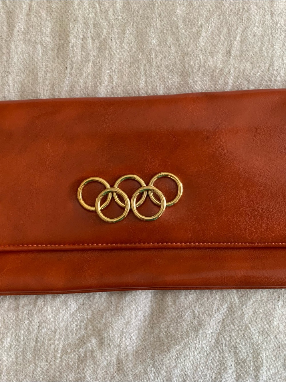Burnt Orange Leather Clutch with Gold Ring Detail